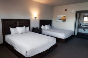Photo of one of our Hotel Rooms furnished with two Double Queen Beds